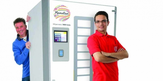 Two people around a vending machine