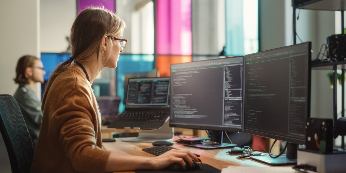 A developer reviews and writes code across several screens in order to design, document and maintain an API, defining its endpoints, parameters and integration rules. 