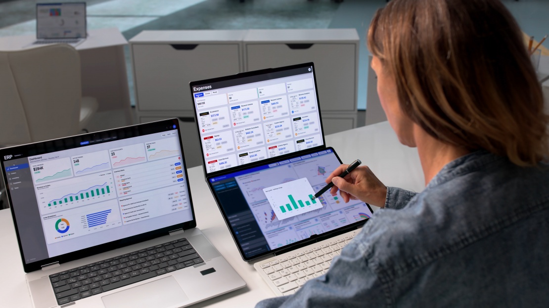 A member of staff analyses financial dashboards to track the inflation impact on business and optimise expenditure management.