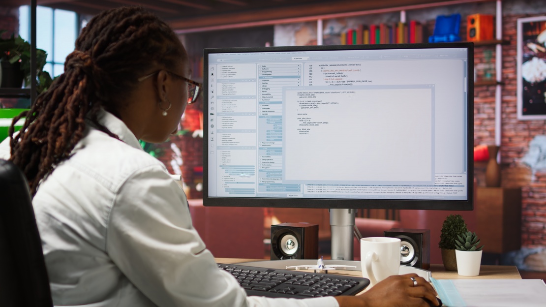 An analyst examines technical data to contribute to TCTO. 