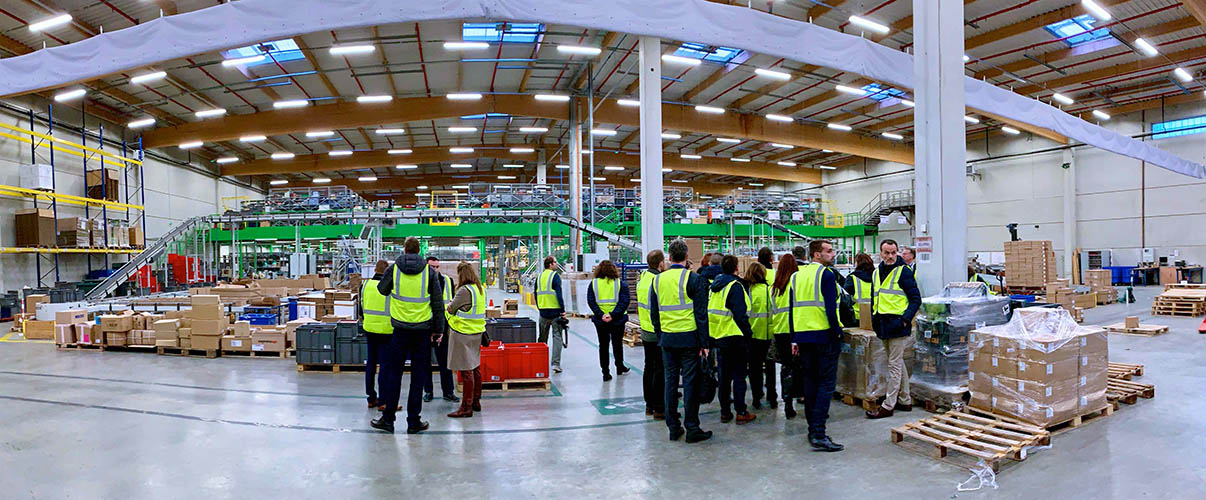 People visiting a warehouse in Manutan