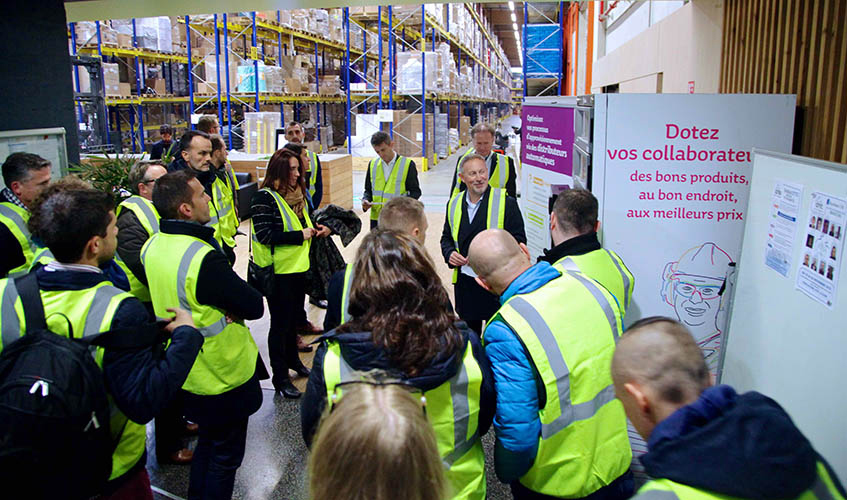 People visiting a warehouse in Manutan