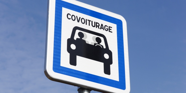 Photo of a sign with carpooling written on it