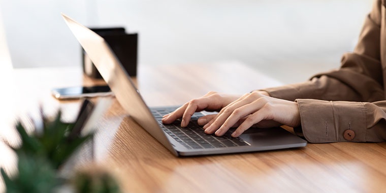 Photo of a woman using a computer