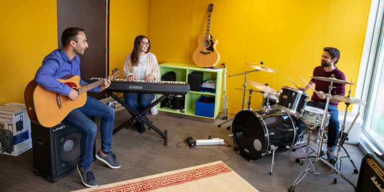 Photo of employees using musical instruments 