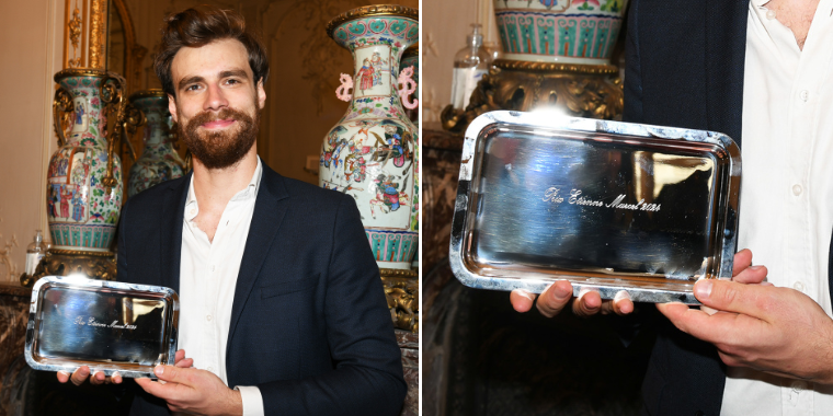 Pierre-Emmanuel Saint-Esprit is holding the Etienne Marcel Award in his hands.