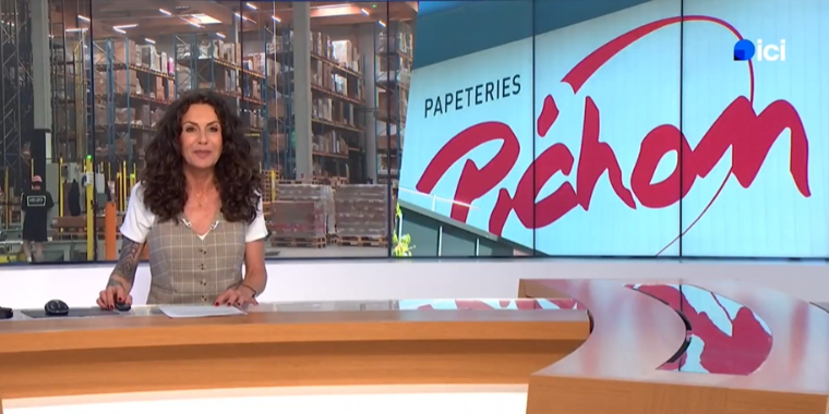 Claire Exbrayat on the France 3 Rhône-Alpes news set, with the Pichon logo displayed in the background
