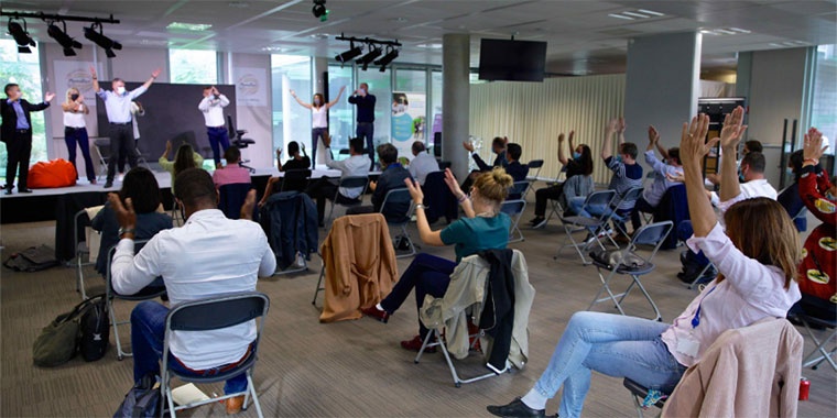 photo showing several people together applauding