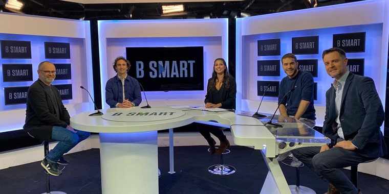 Photo of four men and one woman on the BSMART set